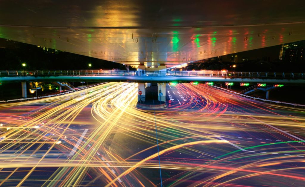 Image of fast-moving high-volume city traffic.