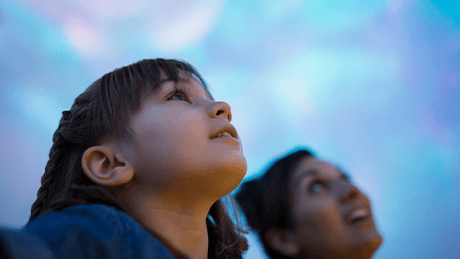 Two people gazing up into the sky