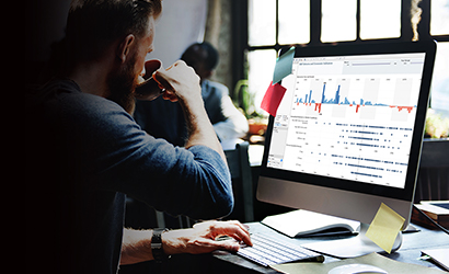 Man at desk using API Management software